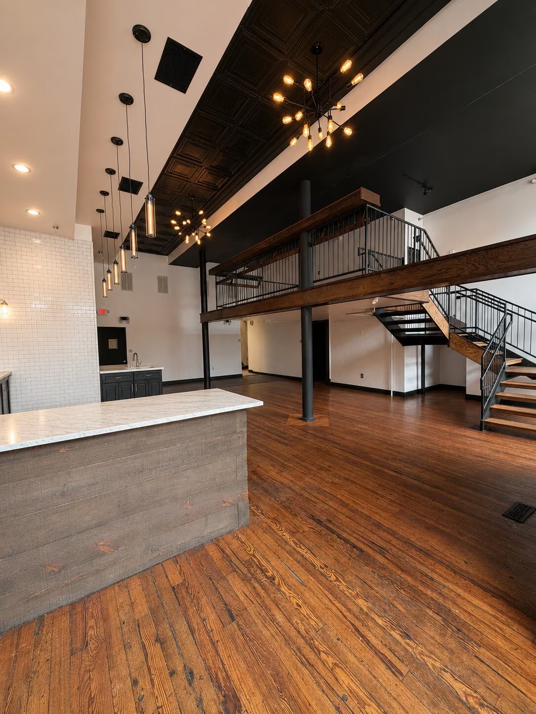 Ground-floor commercial space with mezzanine and original wood floors